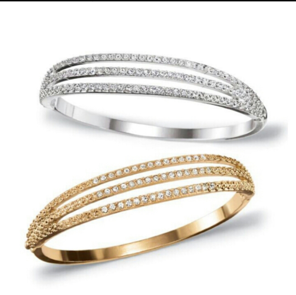 Gold Rhinestone Bangle.
From Avon. Brand new.
